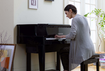 Student playing pre-owned digital piano